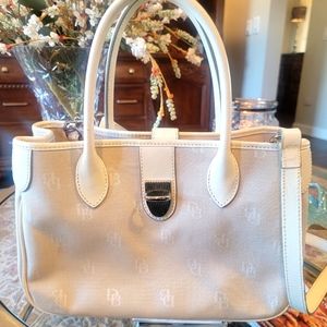 Dooney & Bourke beige handbag pink lining used in good condition.